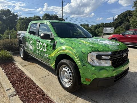 The Eco Auto Clean mobile detailing truck parked in a driveway